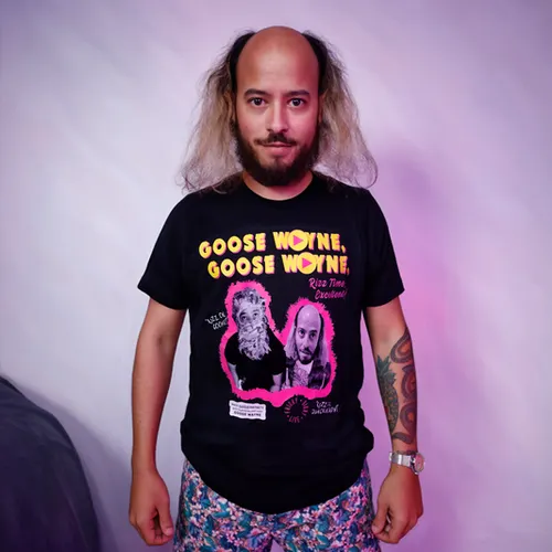 Goose Wayne modeling his apparel in the studio