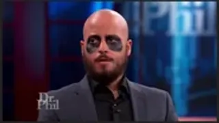 Goose Wayne wearing sunglasses on television
